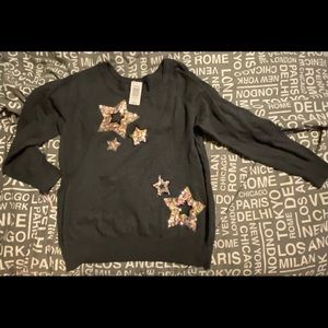 Torrid woman’s NWT cotton star sweater.